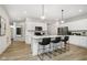 Kitchen with bar seating featuring stainless appliances, quartz counters, and pendant lighting at 18763 Moray St, Westfield, IN 46074