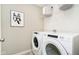 Functional laundry room equipped with modern washer and dryer for convenience at 18763 Moray St, Westfield, IN 46074