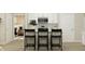 Modern kitchen with a sleek island and stylish bar stools at 19473 Boulder Brook Ln, Westfield, IN 46074