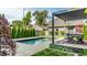 Inviting backyard pool with an adjacent pergola covered dining area, perfect for outdoor enjoyment and entertaining at 2036 Central Ave, Indianapolis, IN 46202