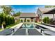 Stunning backyard with a luxurious swimming pool, lounge area, and well-manicured lawn, perfect for summer gatherings at 2036 Central Ave, Indianapolis, IN 46202