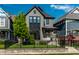 Charming two-story home with black trim, landscaped yard, and an inviting front porch at 2036 Central Ave, Indianapolis, IN 46202