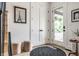 Bright foyer with a glass front door, light floors, decorative rug, and contemporary decor at 2036 Central Ave, Indianapolis, IN 46202