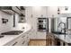 Gourmet kitchen featuring stainless steel appliances, a gas cooktop, and custom white cabinetry at 2036 Central Ave, Indianapolis, IN 46202