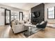 Comfortable living room featuring a fireplace, sleek furniture, and seamless flow to the outdoors at 2036 Central Ave, Indianapolis, IN 46202