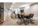Finished basement with dining table and chairs, a comfortable couch, and a mounted tv at 2036 Central Ave, Indianapolis, IN 46202
