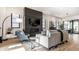 Cozy living room with a fireplace and stylish decor, bathed in natural light at 2036 Central Ave, Indianapolis, IN 46202