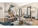 Open-concept living room featuring modern decor, stylish furniture, and abundant natural light at 2036 Central Ave, Indianapolis, IN 46202