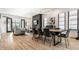 Open concept living space with light wood floors, dining area, and modern fireplace at 2036 Central Ave, Indianapolis, IN 46202