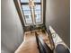 Entry staircase features wooden steps, modern railings, and an abundance of natural light at 2036 Central Ave, Indianapolis, IN 46202