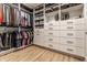 Spacious walk-in closet featuring custom shelves, drawers and hanging storage for optimal organization at 2036 Central Ave, Indianapolis, IN 46202