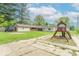 Expansive backyard with a playground and a patio area perfect for outdoor gatherings and Gathering fun at 212 W Banta Rd, Indianapolis, IN 46217