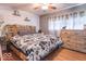 Bedroom with decorative headboard, accent wall and laminate flooring at 212 W Banta Rd, Indianapolis, IN 46217
