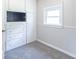 A bedroom showcasing carpeted floors, a built-in closet, and a window for natural light at 212 W Banta Rd, Indianapolis, IN 46217