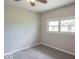 Bedroom with neutral walls, carpet, ceiling fan and double window showcasing outdoor view at 212 W Banta Rd, Indianapolis, IN 46217