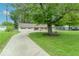 Charming single-story house with a spacious yard, mature trees, and a swing at 212 W Banta Rd, Indianapolis, IN 46217