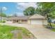 Cozy single-story house with a large front yard and a spacious driveway at 212 W Banta Rd, Indianapolis, IN 46217