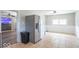 An eat-in kitchen with stainless steel refrigerator, neutral walls and tile flooring at 212 W Banta Rd, Indianapolis, IN 46217