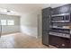 A kitchen with stainless steel oven/microwave combination, tile flooring and neutral walls at 212 W Banta Rd, Indianapolis, IN 46217