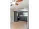 Kitchen includes stainless steel appliances, grey cabinets and ceramic tile flooring at 212 W Banta Rd, Indianapolis, IN 46217