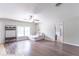 Open living space featuring hardwood floors, a large window, a fan, and a comfortable couch at 212 W Banta Rd, Indianapolis, IN 46217