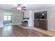 Inviting living area with wood-look floors, a fireplace, and a view into the next room at 212 W Banta Rd, Indianapolis, IN 46217
