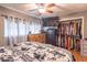 Main bedroom features a closet, laminate floors, and neutral paint at 212 W Banta Rd, Indianapolis, IN 46217