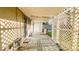 Enclosed porch constructed with aged wood and lattice detailing, leading to the backyard at 2221 Station St, Indianapolis, IN 46218