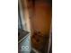 A small, enclosed bathroom with sink and cabinet next to the shower at 2221 Station St, Indianapolis, IN 46218