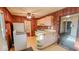Small kitchen offers essential appliances and connections to other rooms at 2221 Station St, Indianapolis, IN 46218