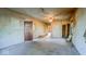 Spacious living room featuring neutral walls, ceiling fan, and wood trim at 2221 Station St, Indianapolis, IN 46218