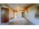 Living room with neutral walls, wood trim and ceiling fan at 2221 Station St, Indianapolis, IN 46218