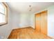 Empty bedroom with hardwood floors, window, and large closet at 2319 E 40Th St, Anderson, IN 46013