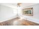 Vacant bedroom featuring wood floors, ceiling fan and window at 2319 E 40Th St, Anderson, IN 46013
