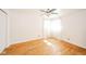 Vacant bedroom featuring wood floors, white walls, and a bright window at 2319 E 40Th St, Anderson, IN 46013