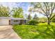 Inviting single-story home with well-maintained landscaping and a classic exterior design at 2319 E 40Th St, Anderson, IN 46013