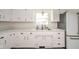 Bright kitchen featuring white cabinets, double basin sink and ample counter space at 2319 E 40Th St, Anderson, IN 46013