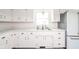 Kitchen featuring bright white cabinets and countertops, stainless steel sink and refrigerator at 2319 E 40Th St, Anderson, IN 46013