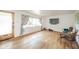 Cozy living room with natural light, hardwood floors, and a view of the front yard at 2319 E 40Th St, Anderson, IN 46013