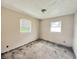 Bedroom awaiting renovation with bare concrete floors, two windows and blank canvas for your design dreams at 2337 N Webster N Ave, Indianapolis, IN 46219