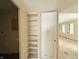 Hallway featuring built in shelving leading to adjacent rooms creating possibilities for new design elements at 2337 N Webster N Ave, Indianapolis, IN 46219