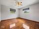 Bedroom featuring hardwood floors, ceiling fan, and natural light at 2399 E Mckay Rd, Shelbyville, IN 46176