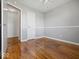 Bright bedroom with hardwood floors and a neutral color scheme at 2399 E Mckay Rd, Shelbyville, IN 46176