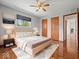 Cozy main bedroom with neutral tones, complemented by wood floors and natural light at 2399 E Mckay Rd, Shelbyville, IN 46176