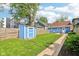 Well-maintained backyard with a shed, patio, and ample green space for outdoor activities at 253 E Minnesota St, Indianapolis, IN 46225