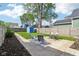 Grassy backyard featuring a storage shed, patio seating, and a well-kept lawn at 253 E Minnesota St, Indianapolis, IN 46225