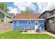 Inviting backyard with a patio set, fire pit, and well-maintained lawn for outdoor relaxation at 253 E Minnesota St, Indianapolis, IN 46225