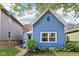 Charming blue home with well-maintained lawn and a cozy, inviting curb appeal at 253 E Minnesota St, Indianapolis, IN 46225