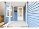 Welcoming porch showcasing details like the door, siding, and front entry details at 253 E Minnesota St, Indianapolis, IN 46225