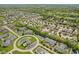 Aerial view of neighborhood featuring homes surrounding lush ponds at 2726 Reflection Way, Greenwood, IN 46143